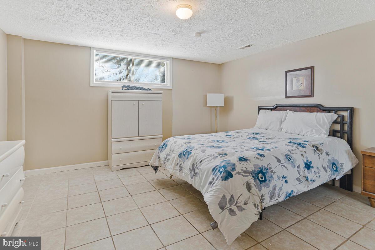 9012 Phyllis Drive Clinton, MD 20735 - Photo 26 of 33 a bedroom with a bed and window