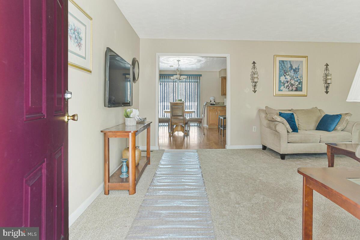 9012 Phyllis Drive Clinton, MD 20735 - Photo 3 of 33 a living room with furniture and a flat screen tv