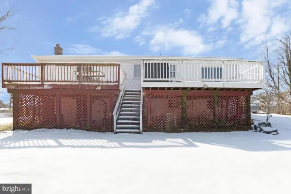 a view of balcony with wooden fence