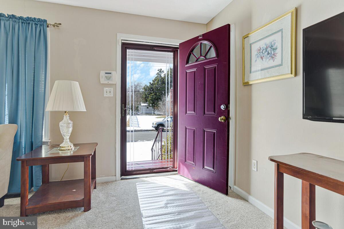 9012 Phyllis Drive Clinton, MD 20735 - Photo 4 of 33 a view of a livingroom with furniture and front door