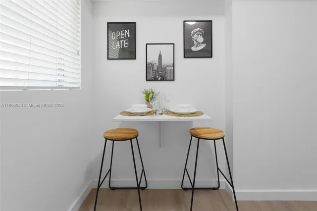 a view of a room with furniture and wooden floor