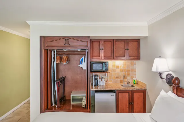 a kitchen with stainless steel appliances granite countertop a refrigerator and stove