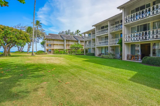 a view of an apartment with a garden