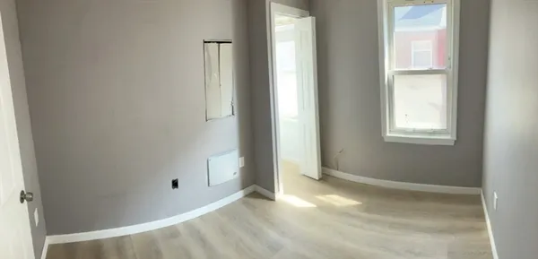 a view of an empty room with windows