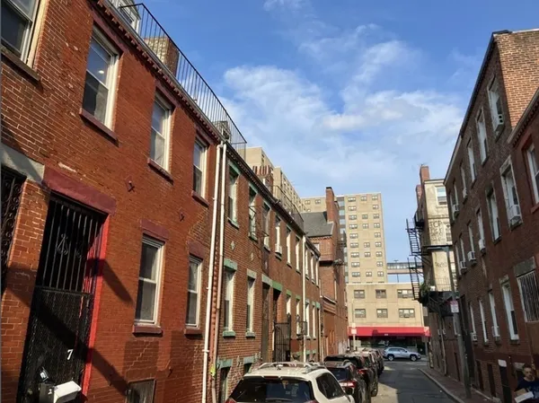a city street lined with tall buildings