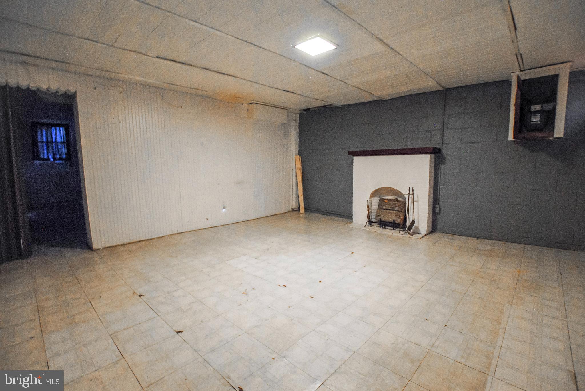 6116 Edlynne Road Baltimore, MD 21239 - Photo 36 of 52 Basement Fire Place