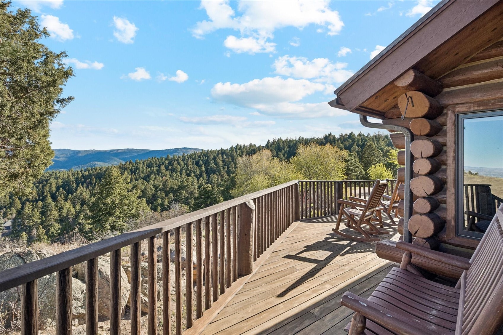 51 West Ranch Trail Morrison, CO 80465 - Photo 28 of 50 a balcony with wooden floor and city view