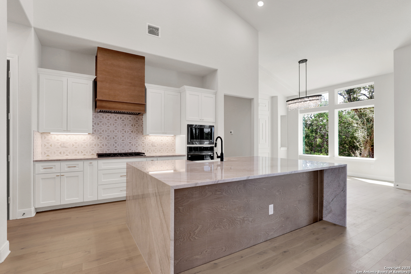 775 Maximino Ridge Bulverde, TX 78163 - Photo 14 of 41 a kitchen with appliances cabinets and a sink