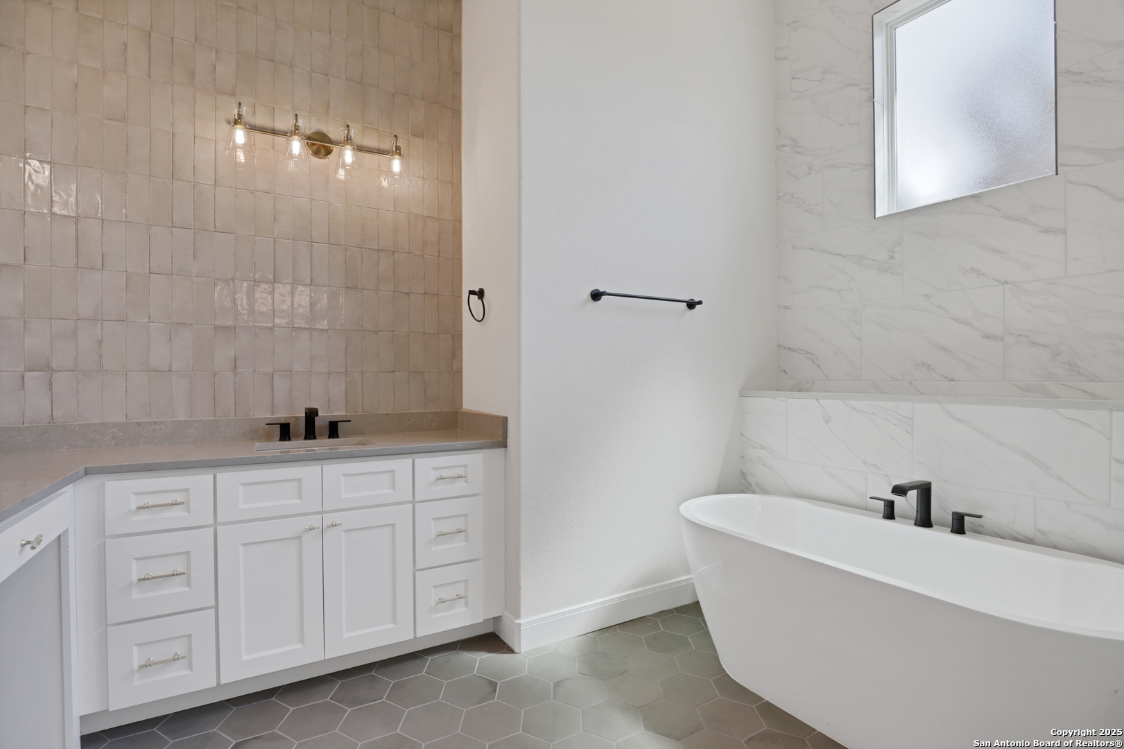 775 Maximino Ridge Bulverde, TX 78163 - Photo 23 of 41 a bathroom with a bathtub and sink