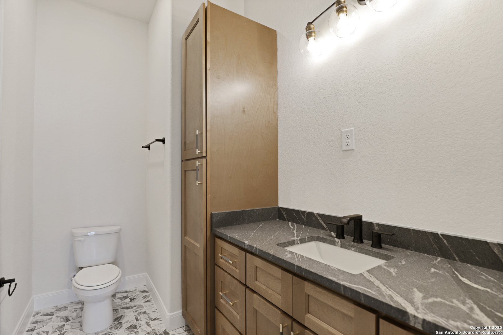 775 Maximino Ridge Bulverde, TX 78163 - Photo 29 of 41 a bathroom with a granite countertop sink and a mirror