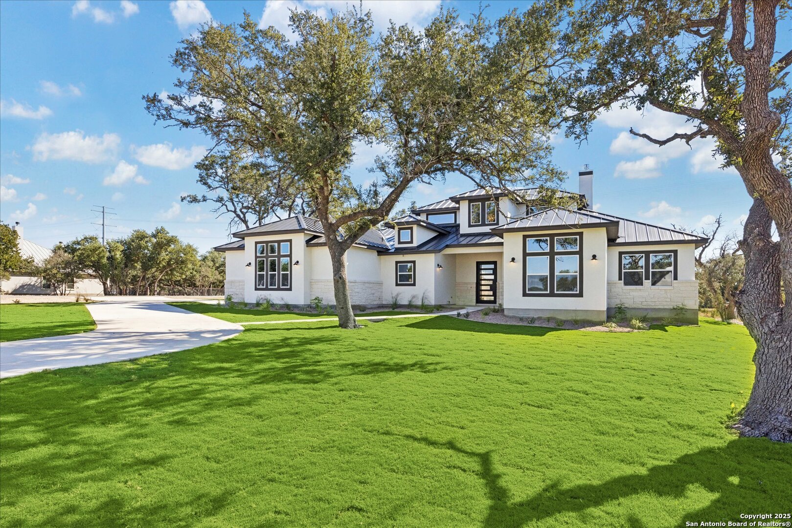 775 Maximino Ridge Bulverde, TX 78163 - Photo 3 of 41 a front view of a house with a yard