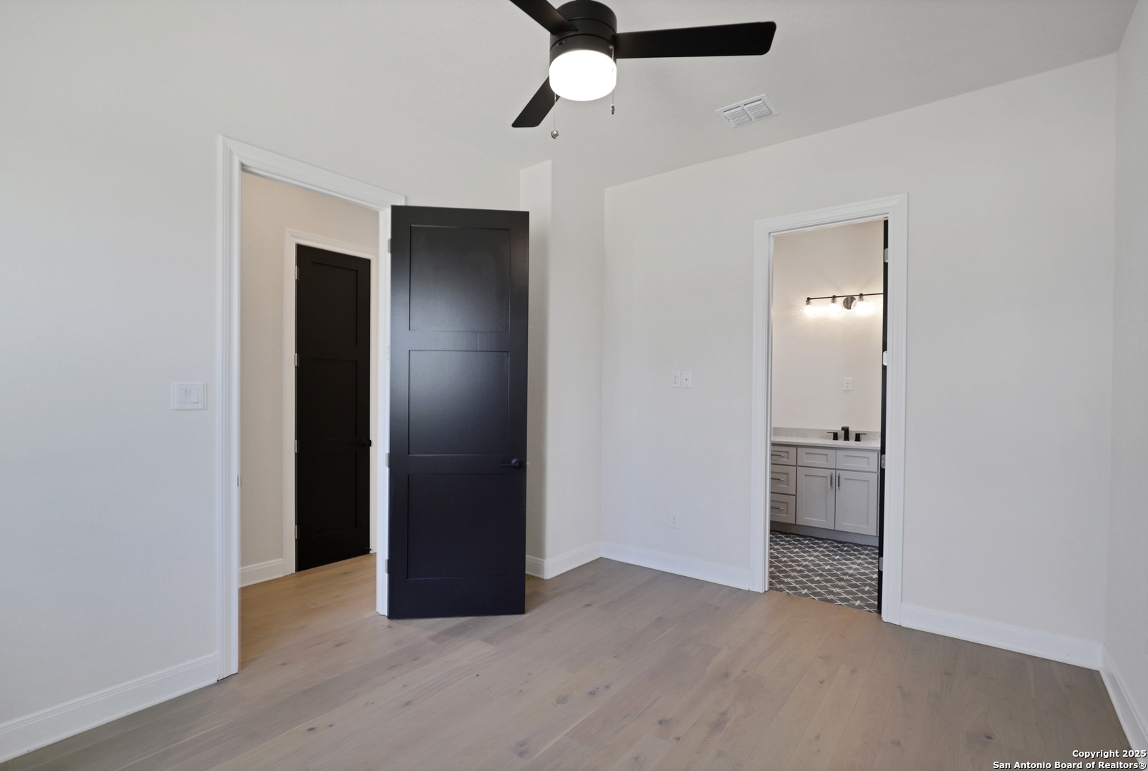 775 Maximino Ridge Bulverde, TX 78163 - Photo 32 of 41 an empty room with closet and windows