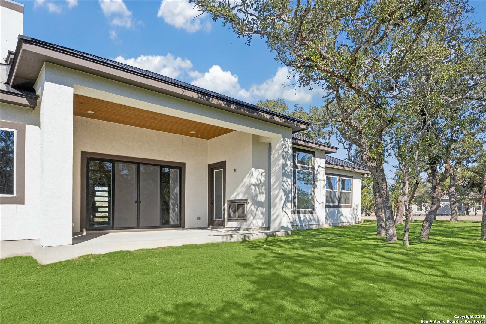 775 Maximino Ridge Bulverde, TX 78163 - Photo 41 of 41 a backyard of a house with a garden and barbeque oven