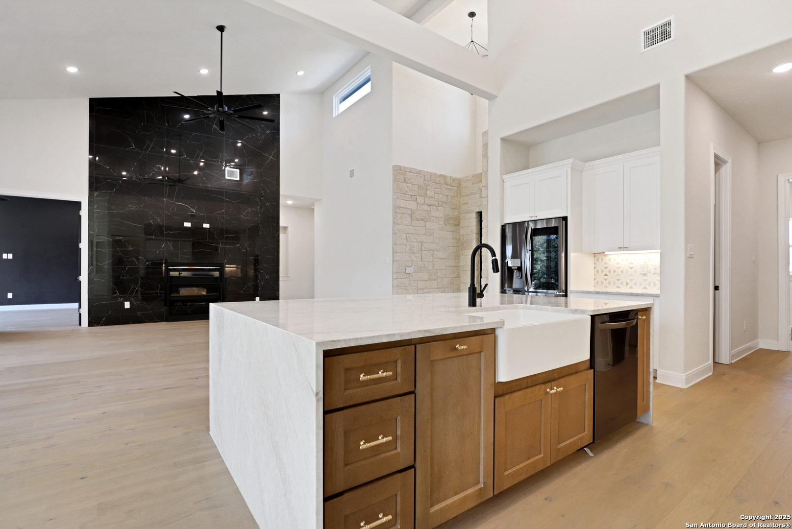 775 Maximino Ridge Bulverde, TX 78163 - Photo 8 of 41 a kitchen with kitchen island a sink stainless steel appliances and cabinets
