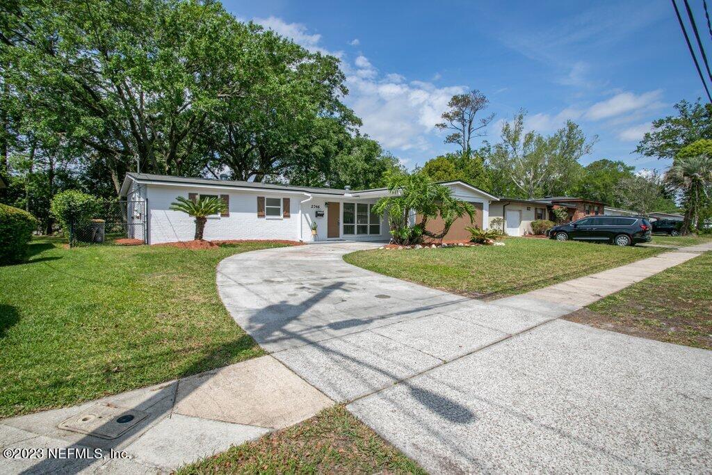 2746 Sam Road Jacksonville, FL 32216 - Photo 1 of 44 a view of a house with a yard