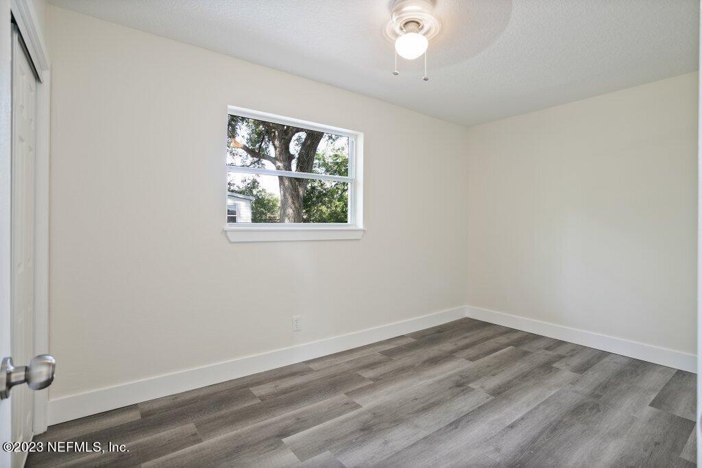 2746 Sam Road Jacksonville, FL 32216 - Photo 25 of 44 wooden floor in an empty room