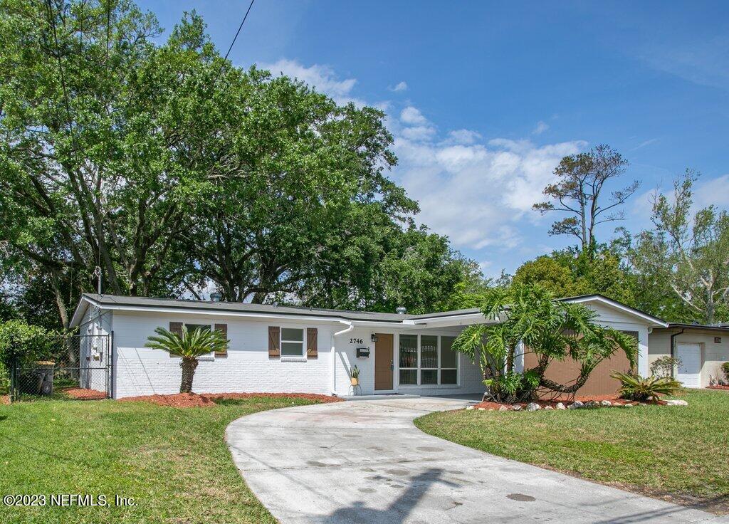 2746 Sam Road Jacksonville, FL 32216 - Photo 3 of 44 front view of a house with a yard