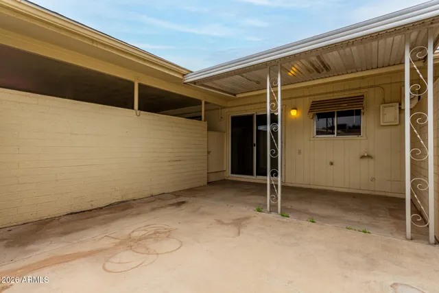 a view of a car park in front of house