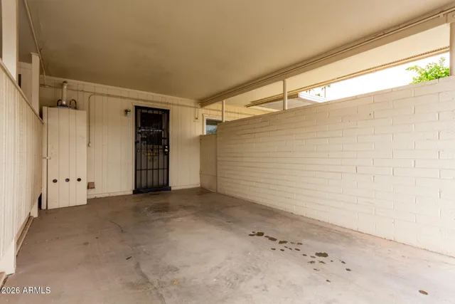 an empty room with a wooden door