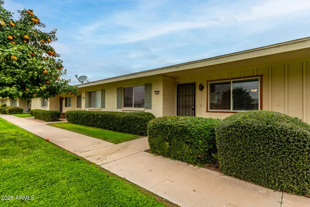 front view of a house with a yard
