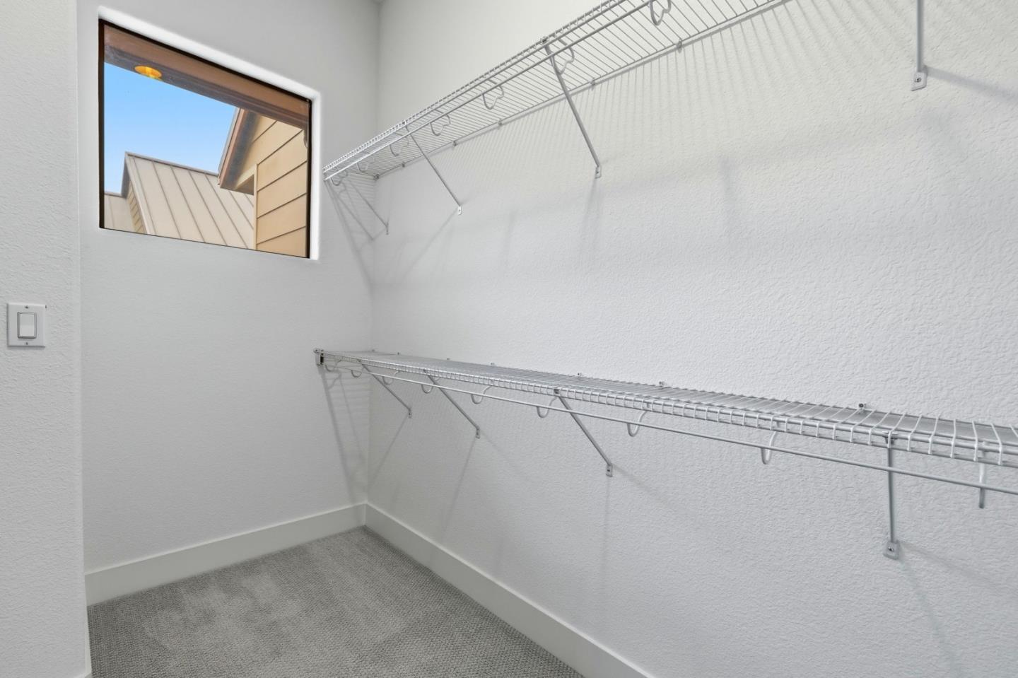 4248 Rickeys Way, Unit H Palo Alto, CA 94306 - Photo 18 of 30 a view of a room with racks on the wall