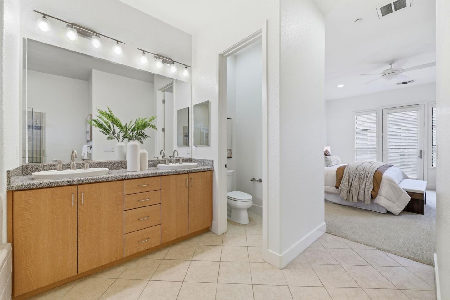 4248 Rickeys Way, Unit H Palo Alto, CA 94306 - Photo 19 of 30 a spacious bathroom with a granite countertop sink and a mirror