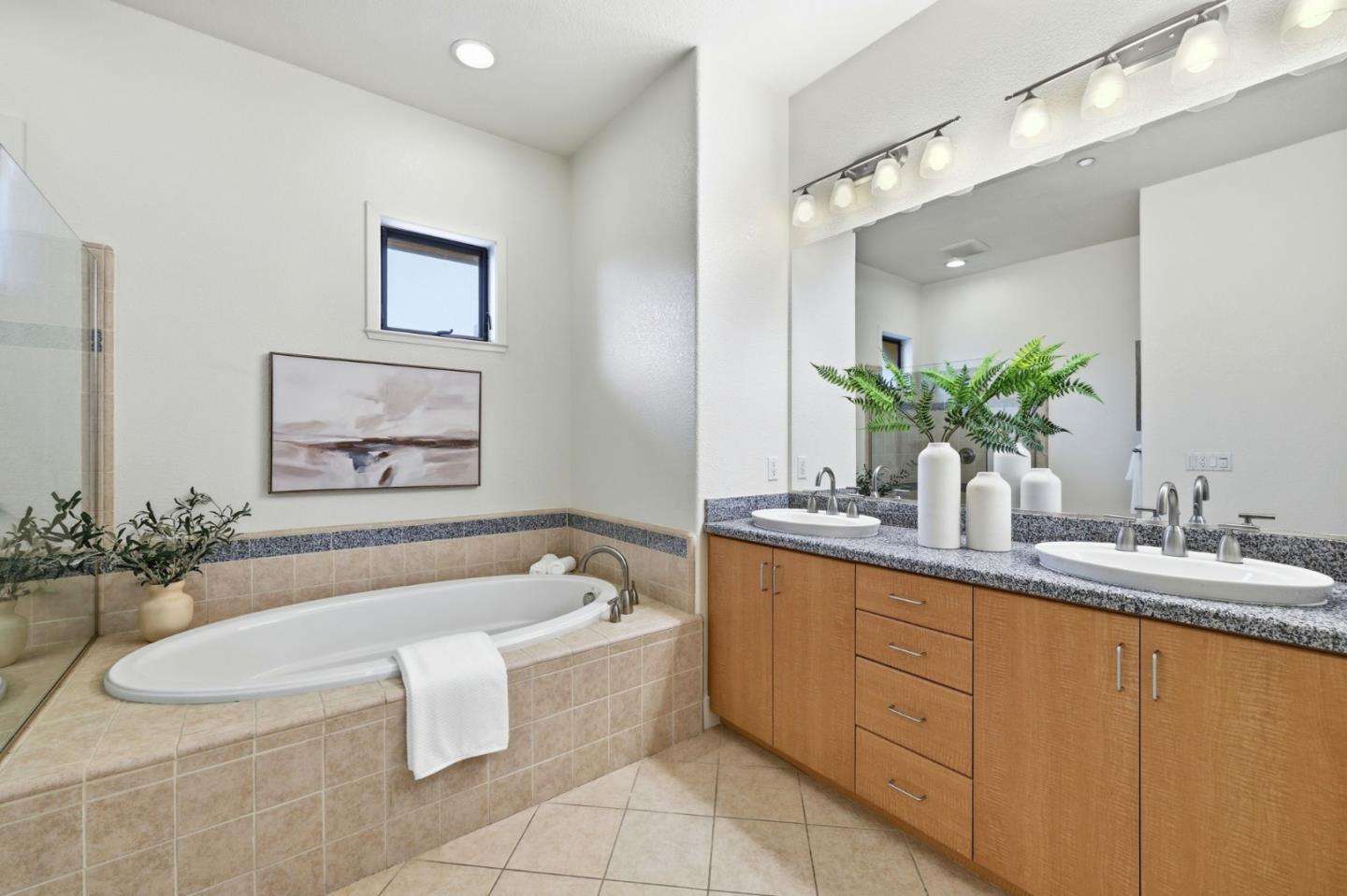 4248 Rickeys Way, Unit H Palo Alto, CA 94306 - Photo 22 of 30 a spacious bathroom with a granite countertop tub sink and mirror