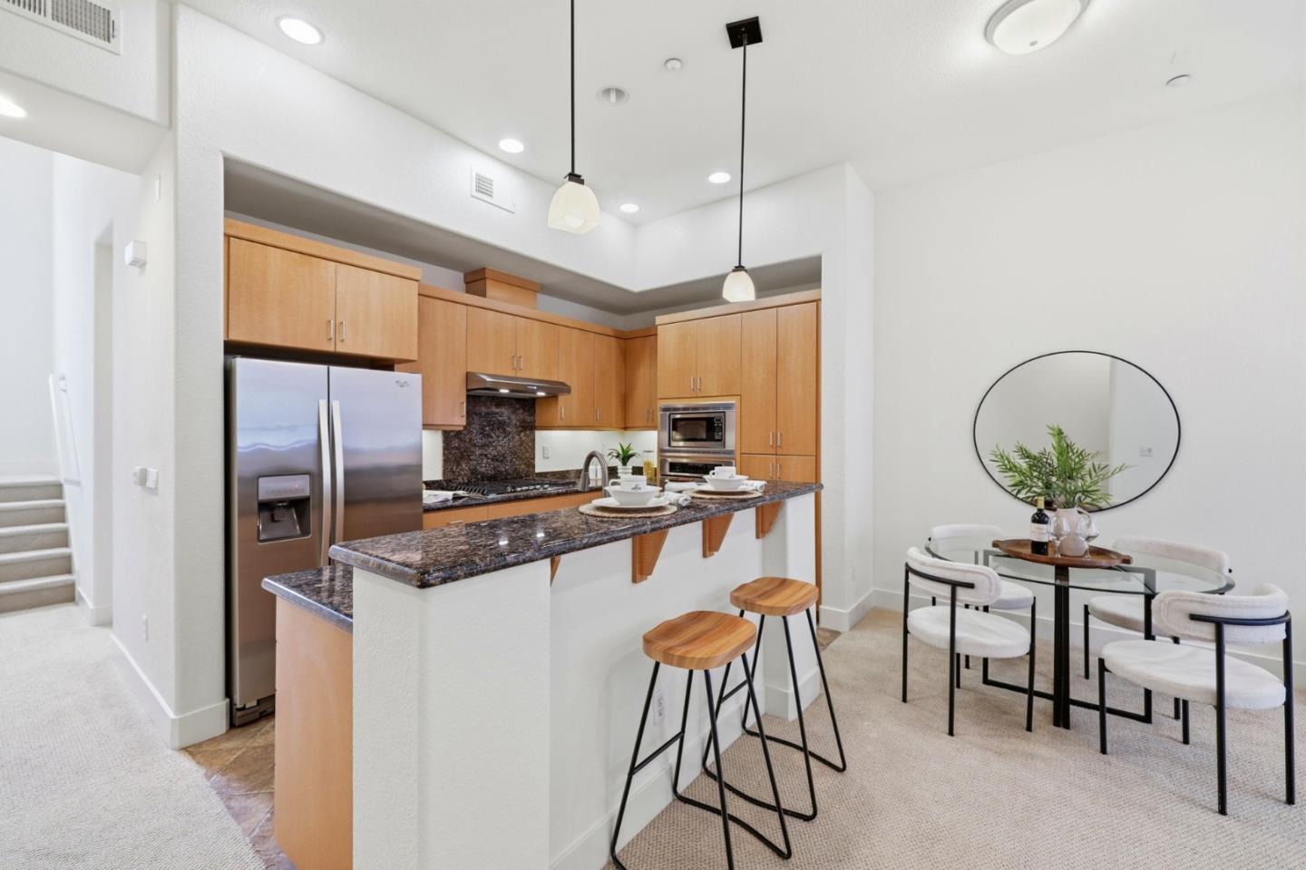 4248 Rickeys Way, Unit H Palo Alto, CA 94306 - Photo 6 of 30 a kitchen with stainless steel appliances granite countertop a stove a refrigerator and a dining table