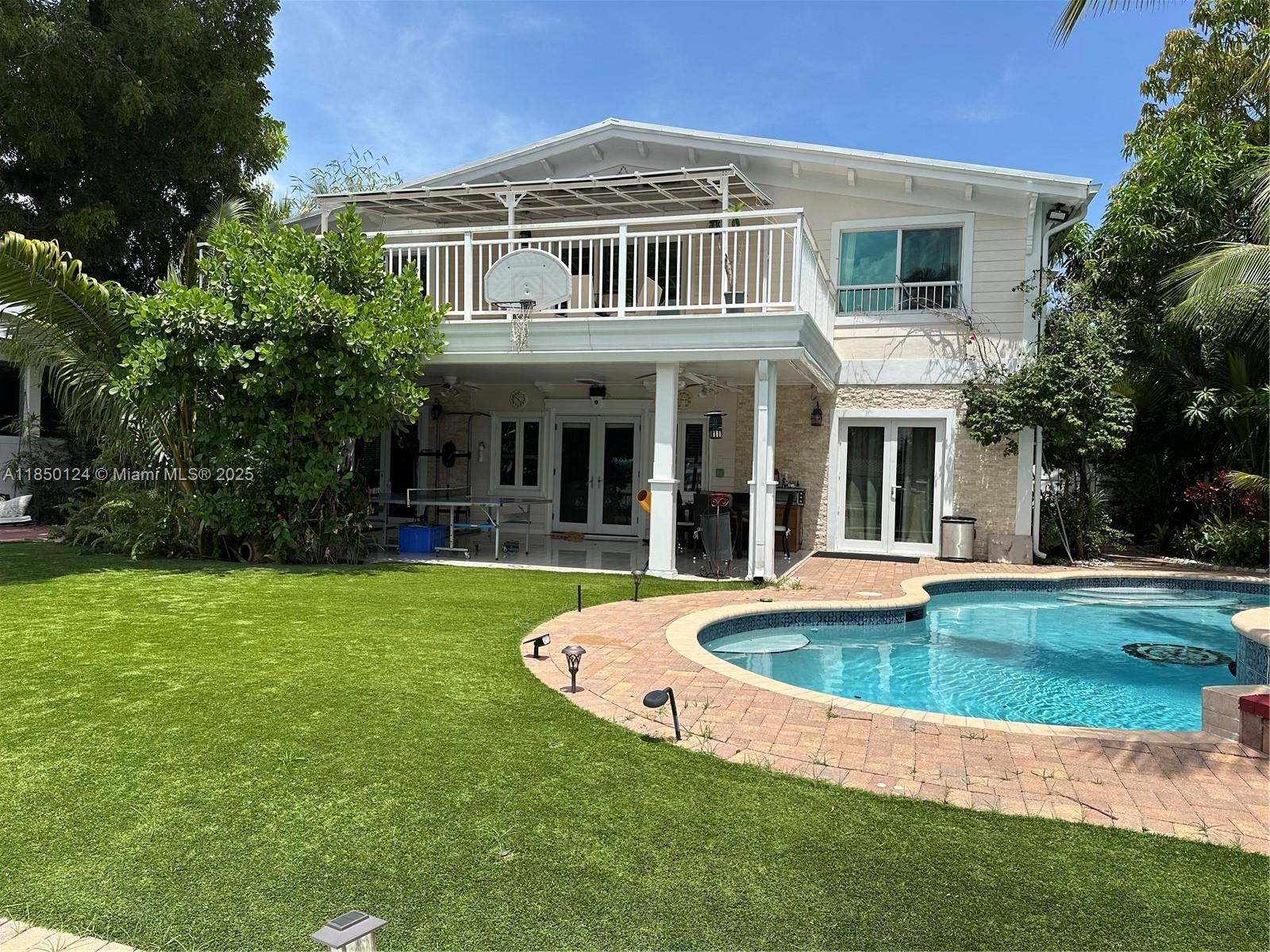 1524 Argyle Drive, Unit 1 Fort Lauderdale, FL 33312 - Photo 2 of 38 a view of a house with a swimming pool
