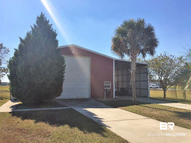 16872 County Road 12 South Foley, AL 36535 - Photo 29 of 35 45x45ft workshop fits 40ft RV and has 30 amp & 50 amp inside w/ exterior covered cleaning station.