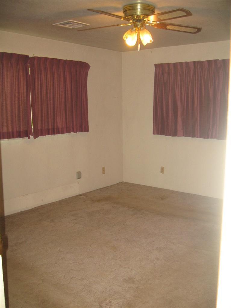 4988 Holland Loop Road Cave Junction, OR 97523 - Photo 24 of 35 a view of an empty room with a window