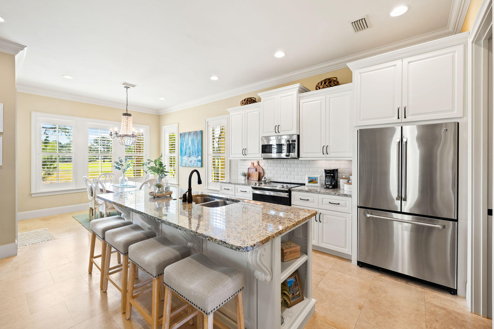 1897 Baytowne Loop Miramar Beach, FL 32550 - Photo 17 of 68 a kitchen with refrigerator a stove and a dining table