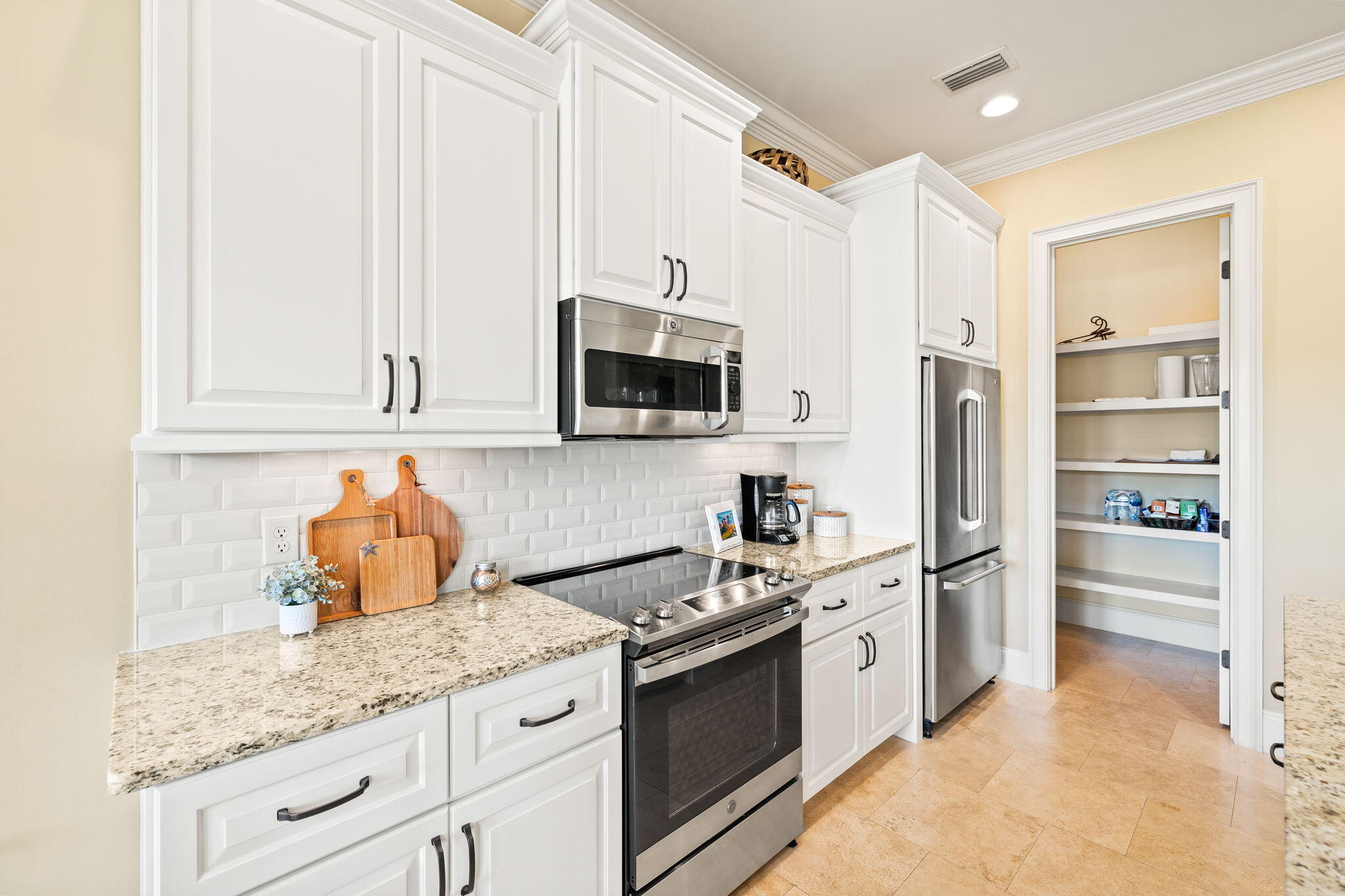 1897 Baytowne Loop Miramar Beach, FL 32550 - Photo 19 of 68 a kitchen with stainless steel appliances granite countertop a stove a sink and a refrigerator