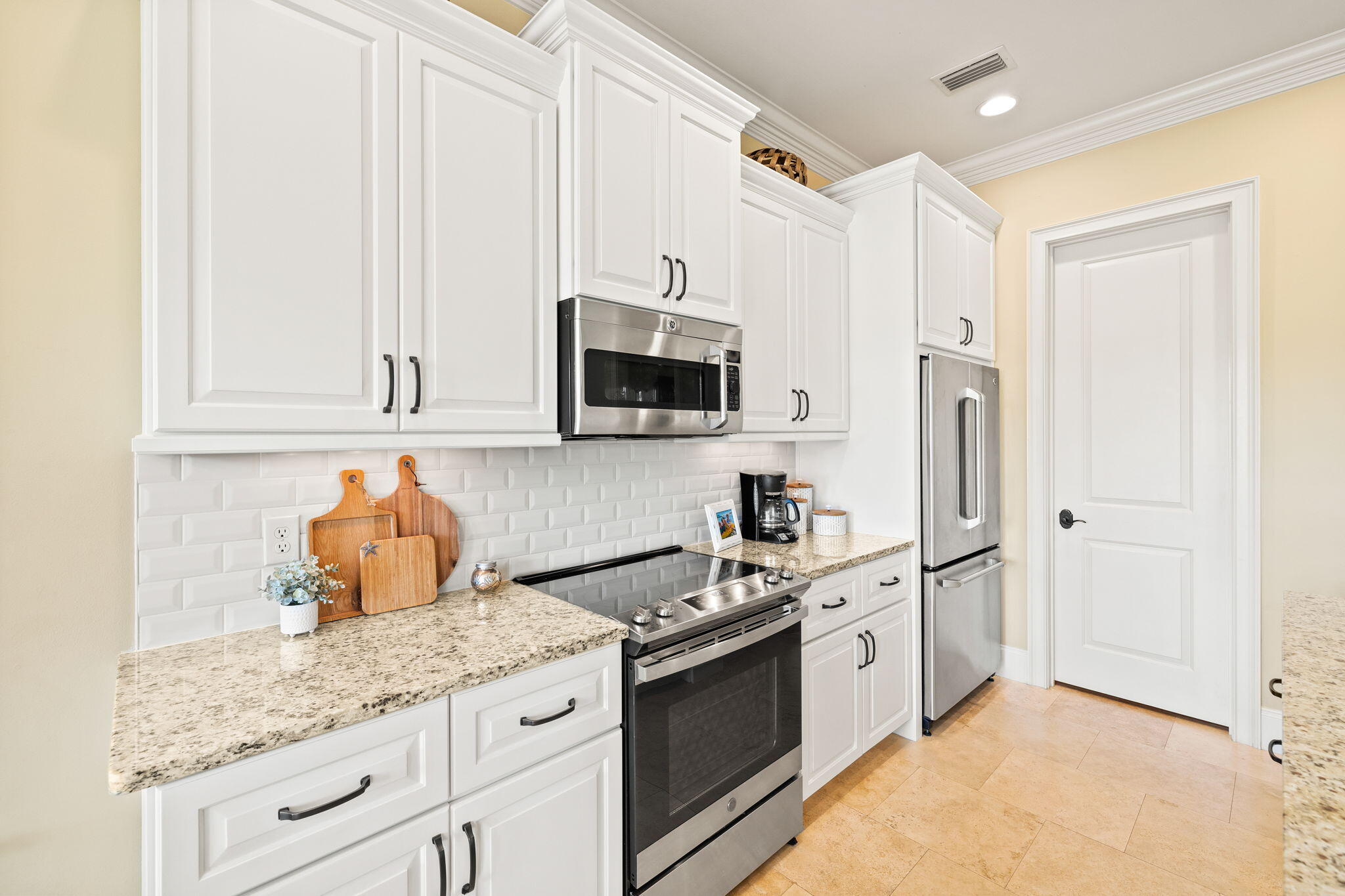1897 Baytowne Loop Miramar Beach, FL 32550 - Photo 20 of 68 a kitchen with stainless steel appliances granite countertop white cabinets and a sink