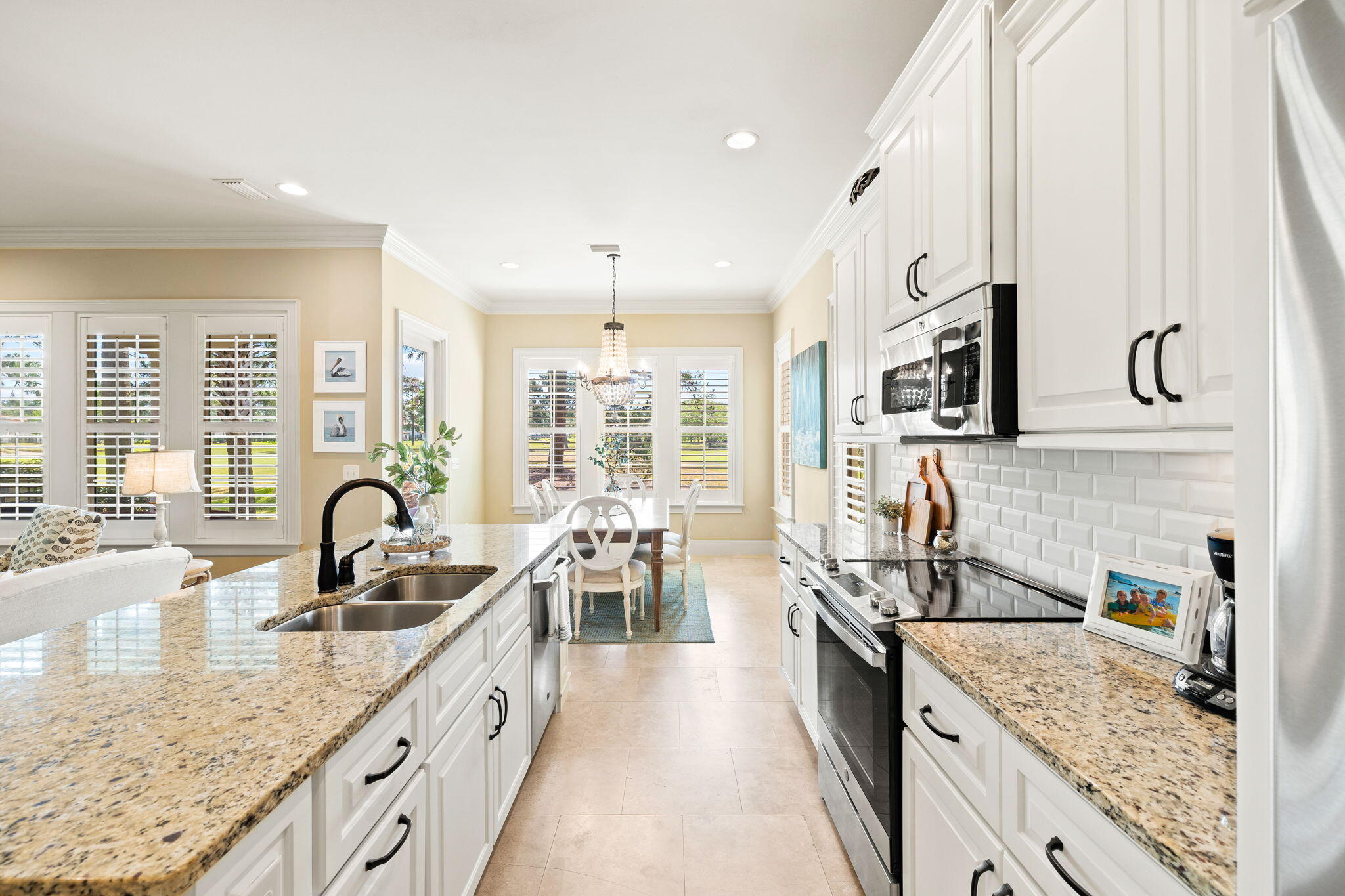 1897 Baytowne Loop Miramar Beach, FL 32550 - Photo 21 of 68 a kitchen with granite countertop a sink and a stove top oven