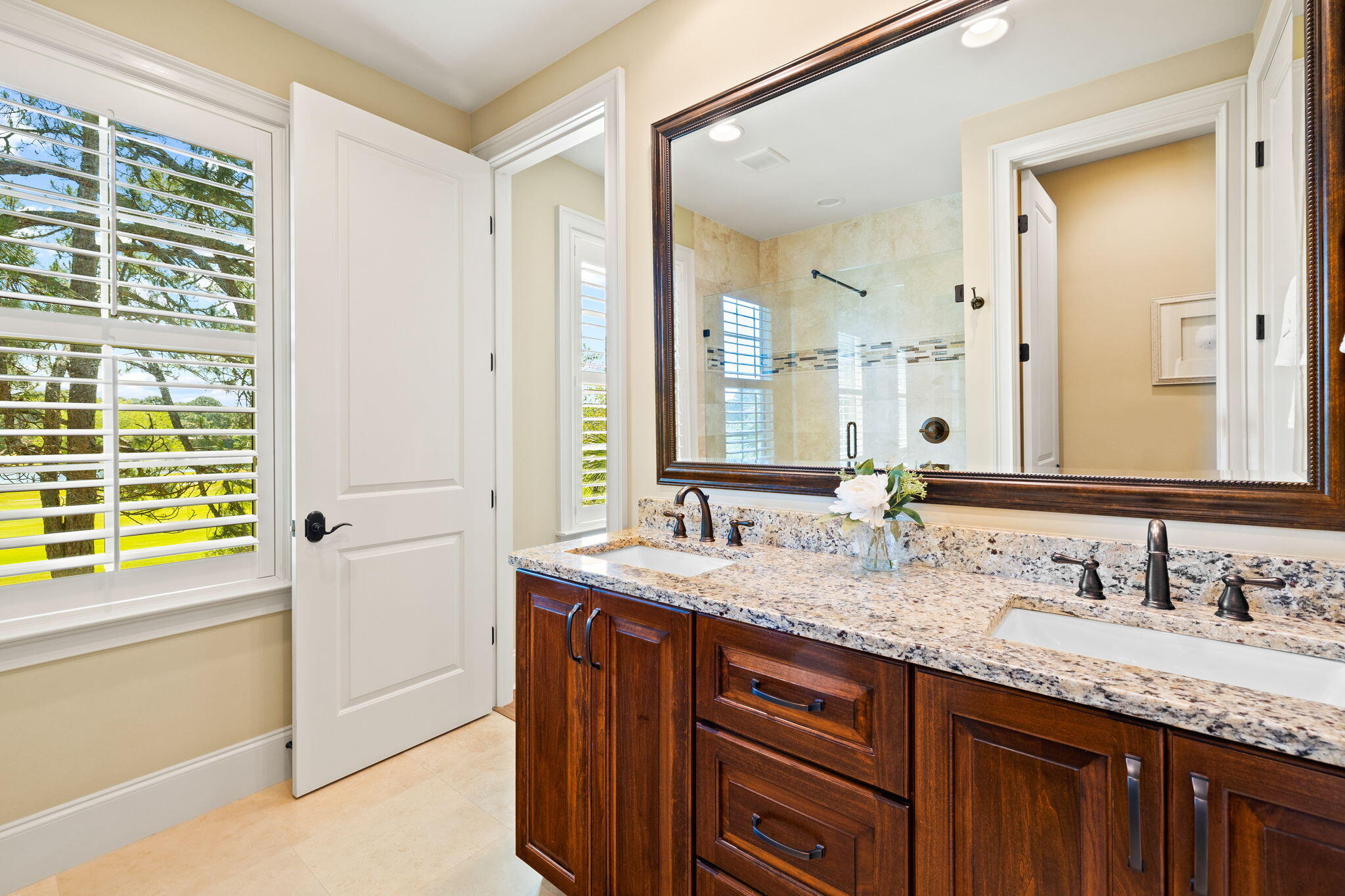 1897 Baytowne Loop Miramar Beach, FL 32550 - Photo 54 of 68 a bathroom with a granite countertop sink and a mirror