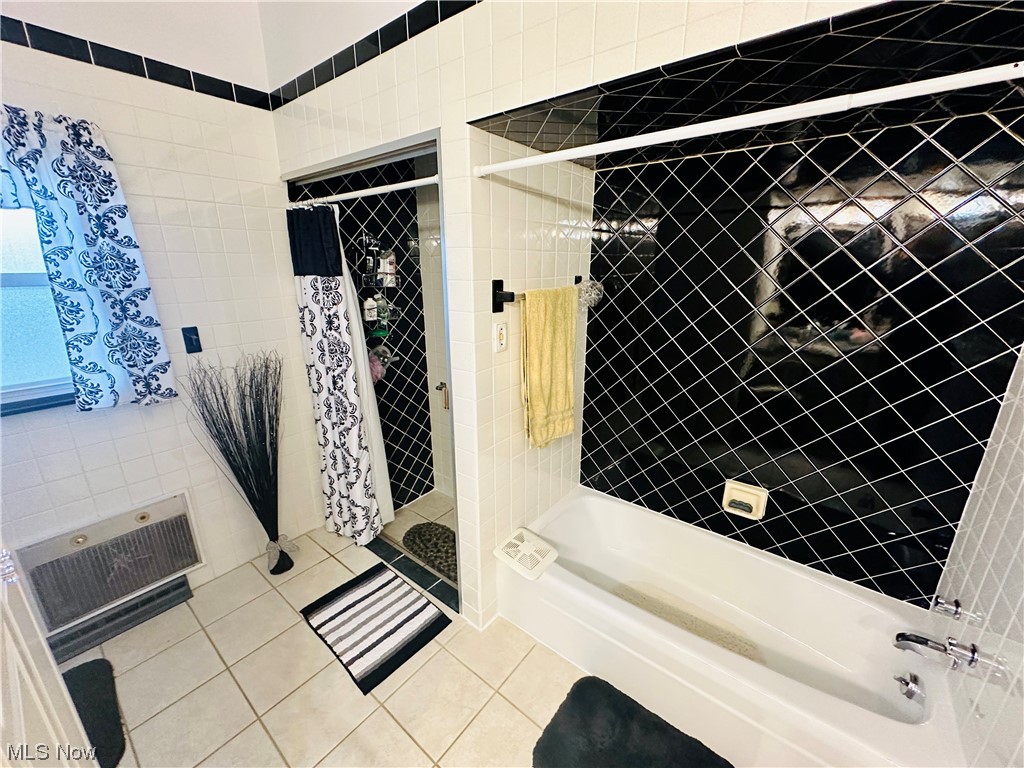 351 Rockdale Road Follansbee, WV 26037 - Photo 15 of 18 Bathroom featuring tile floors, shower / bath combo with shower curtain, and tile walls