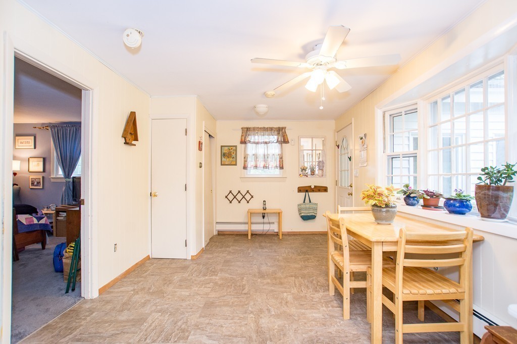 49 Ansie Road Chelmsford, MA 01824 - Photo 12 of 22 a living room with furniture a chandelier and a dining table