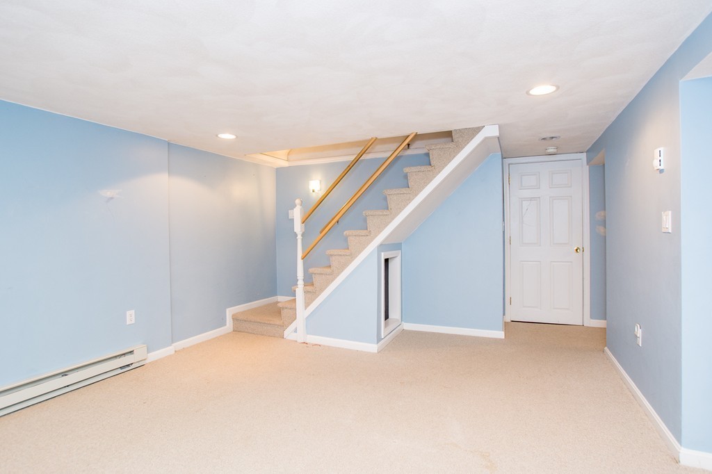 49 Ansie Road Chelmsford, MA 01824 - Photo 16 of 22 a view of an empty room with stairs
