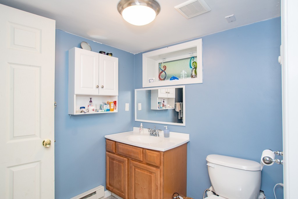 49 Ansie Road Chelmsford, MA 01824 - Photo 17 of 22 a bathroom with a toilet a sink and a window