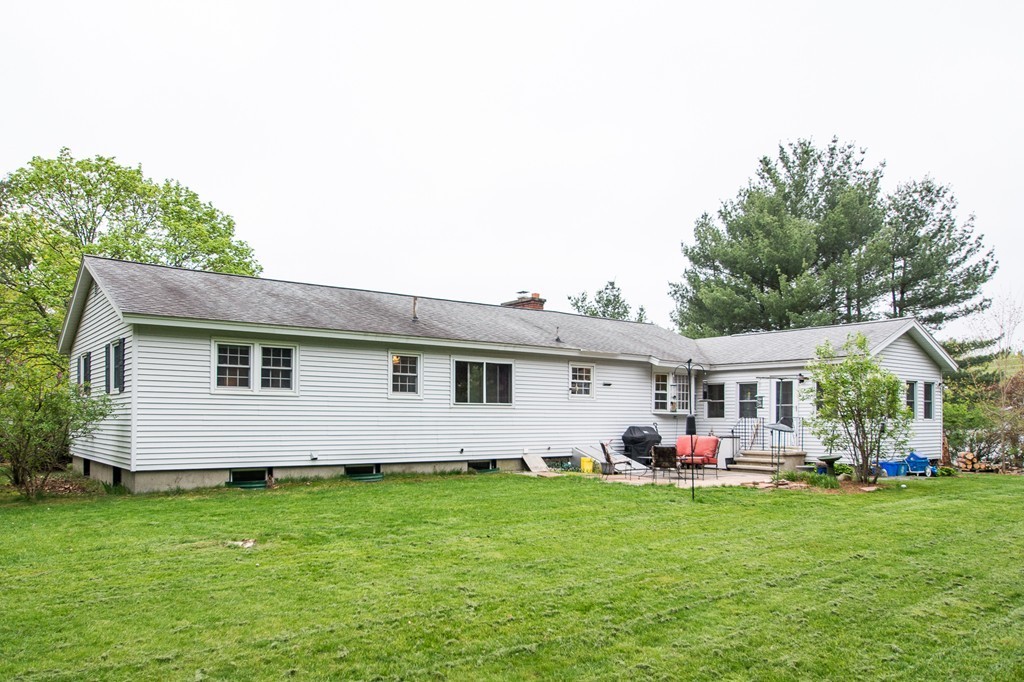 49 Ansie Road Chelmsford, MA 01824 - Photo 20 of 22 a front view of house with yard and outdoor seating