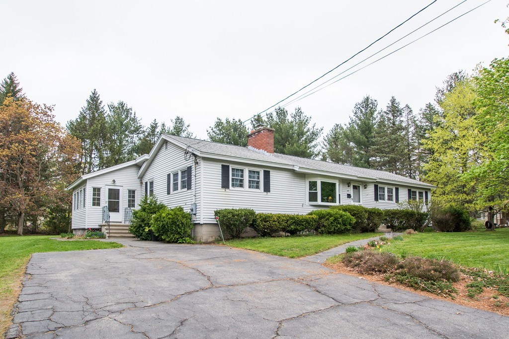 49 Ansie Road Chelmsford, MA 01824 - Photo 2 of 22 a house with trees in the background