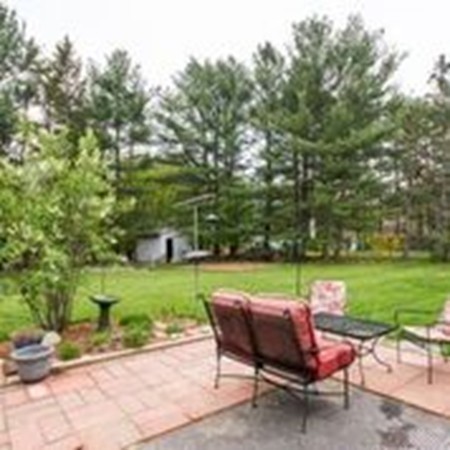 49 Ansie Road Chelmsford, MA 01824 - Photo 21 of 22 a backyard of a house with outdoor seating