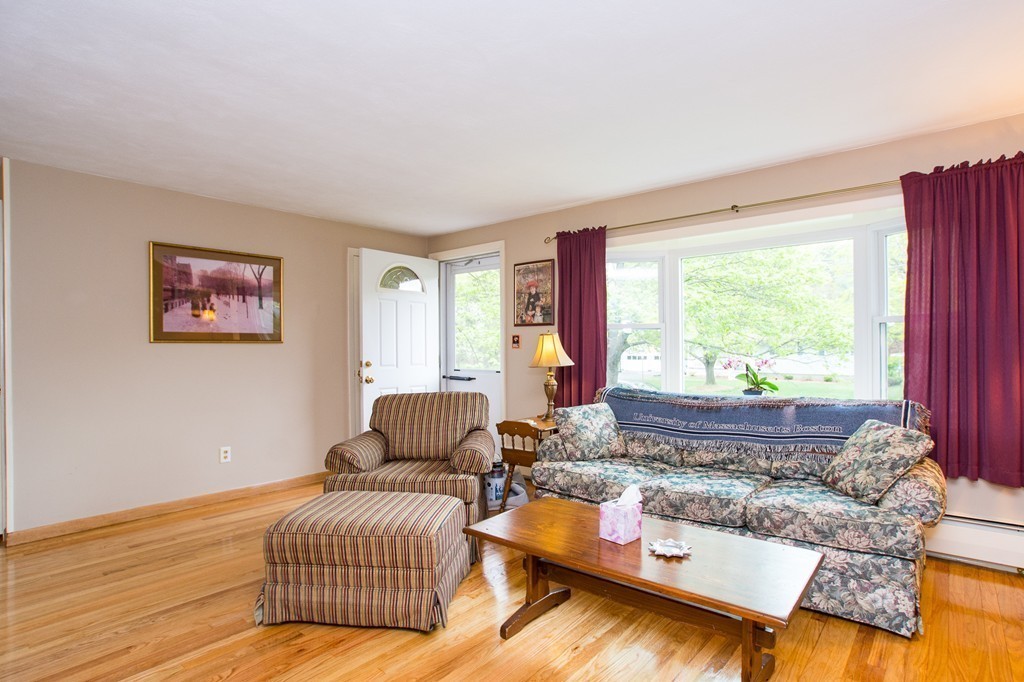 49 Ansie Road Chelmsford, MA 01824 - Photo 4 of 22 a living room with furniture and a large window