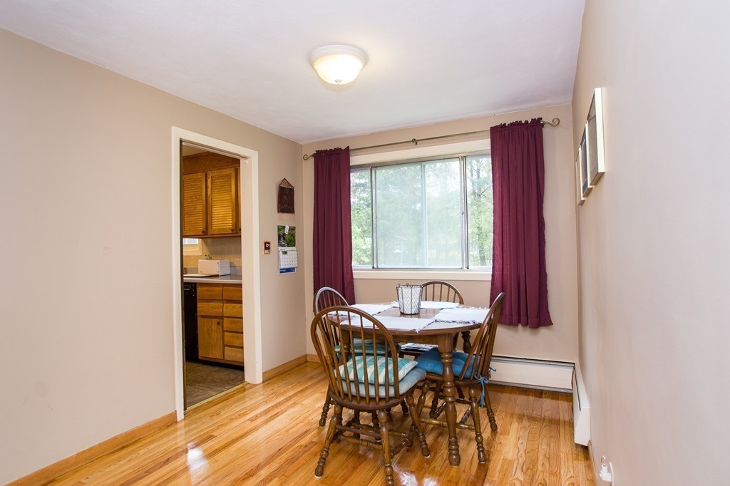 49 Ansie Road Chelmsford, MA 01824 - Photo 7 of 22 a view of a dining room with furniture and wooden floor