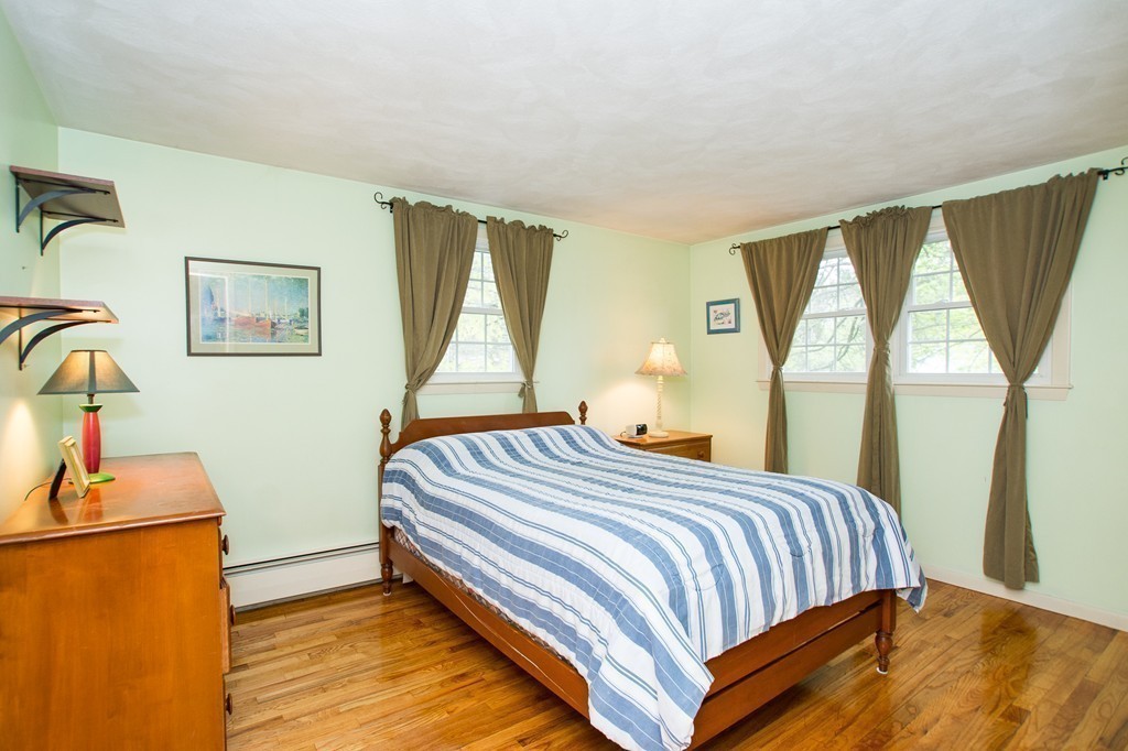 49 Ansie Road Chelmsford, MA 01824 - Photo 10 of 22 a bedroom with a bed and wooden floor