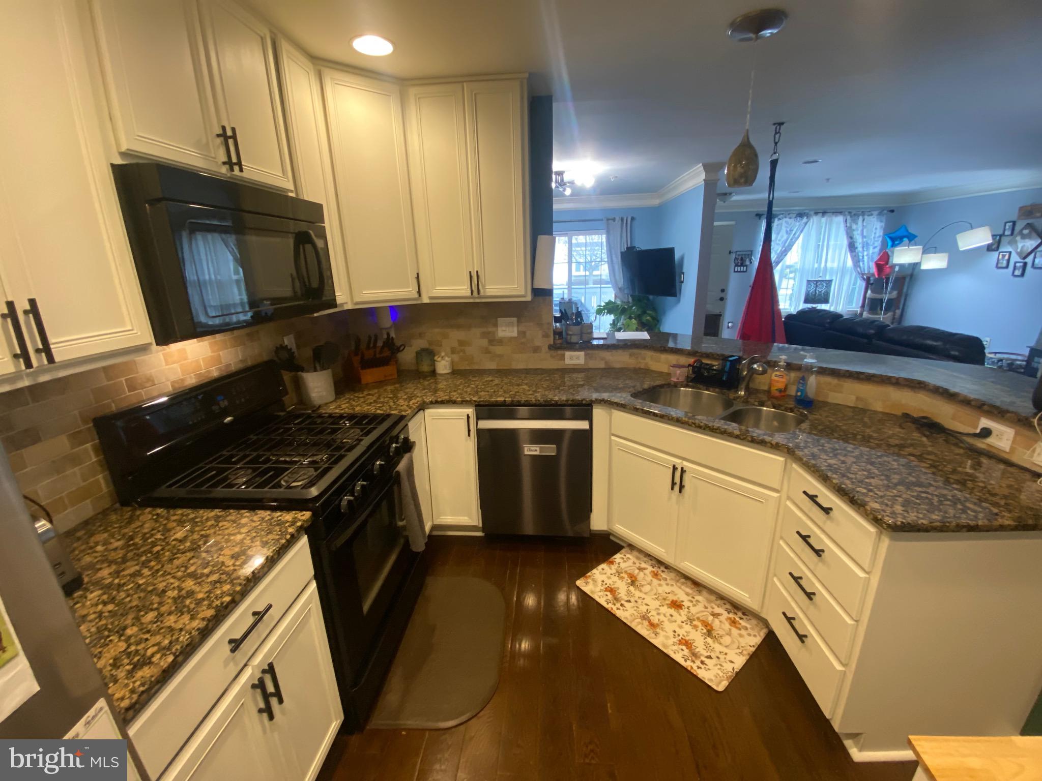 219 Flagstone Road, Unit 6 Chester Springs, PA 19425 - Photo 6 of 15 a kitchen with a sink stove and cabinets