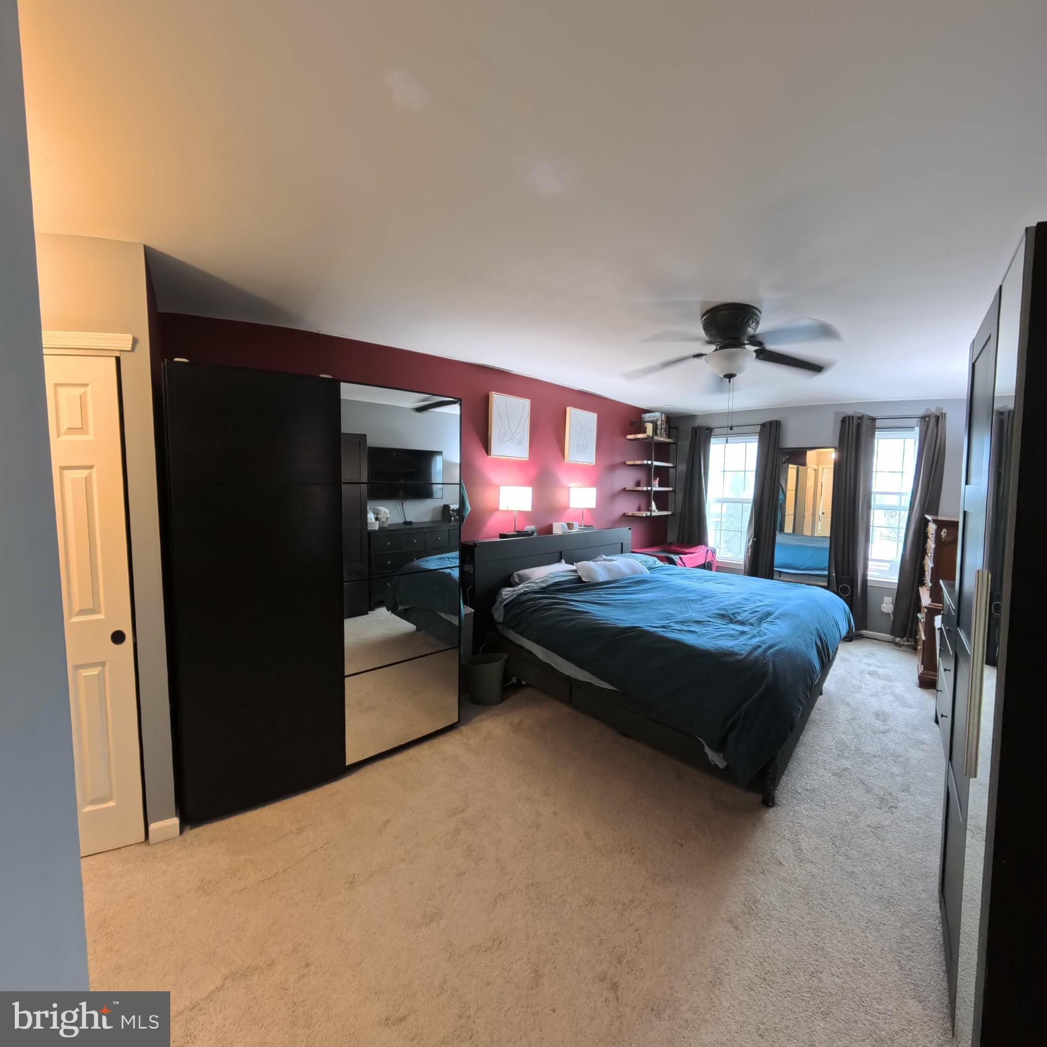 219 Flagstone Road, Unit 6 Chester Springs, PA 19425 - Photo 9 of 15 a bedroom with a large bed and a large window