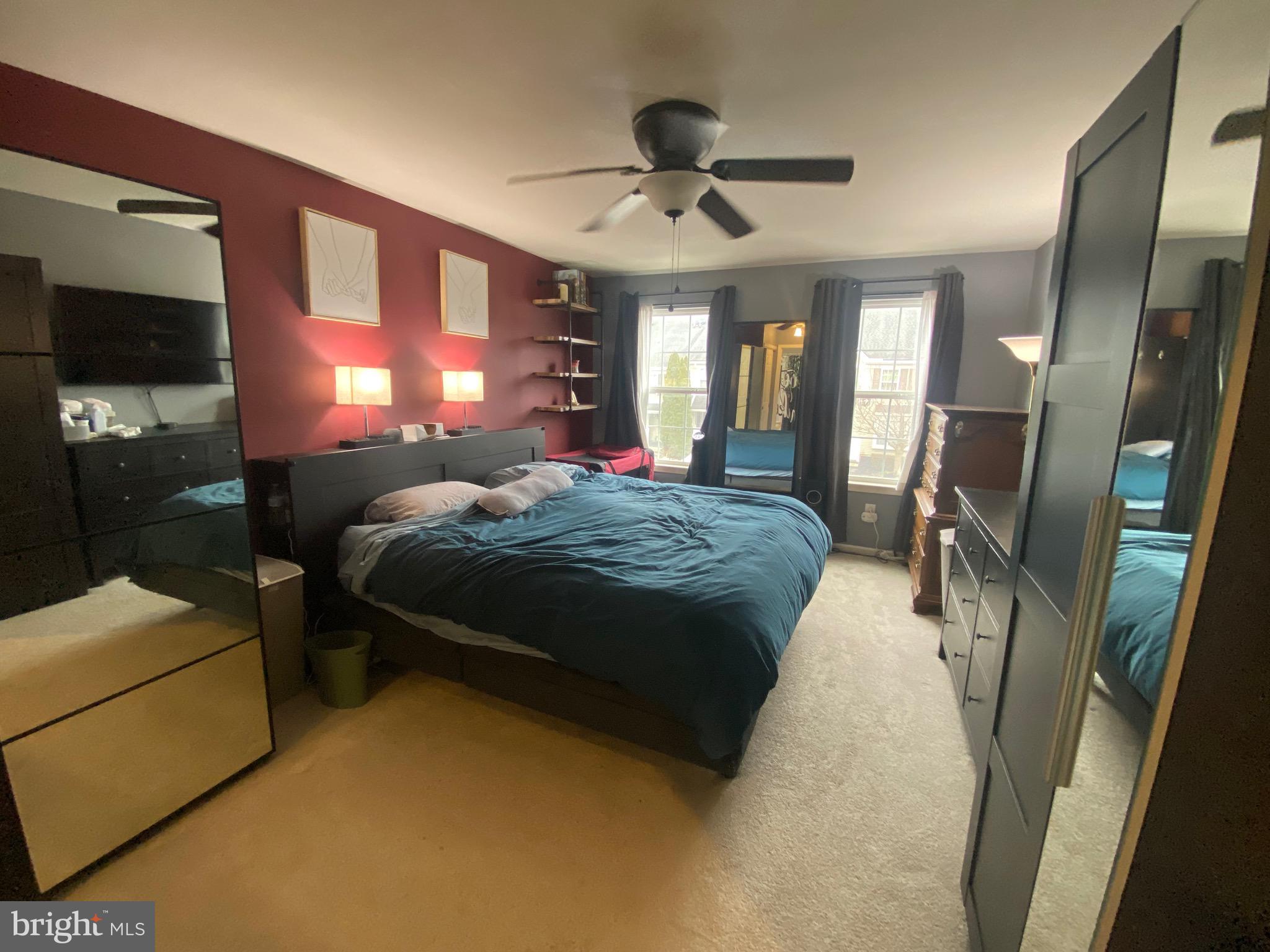 219 Flagstone Road, Unit 6 Chester Springs, PA 19425 - Photo 10 of 15 a spacious bedroom with a bed and a chandelier