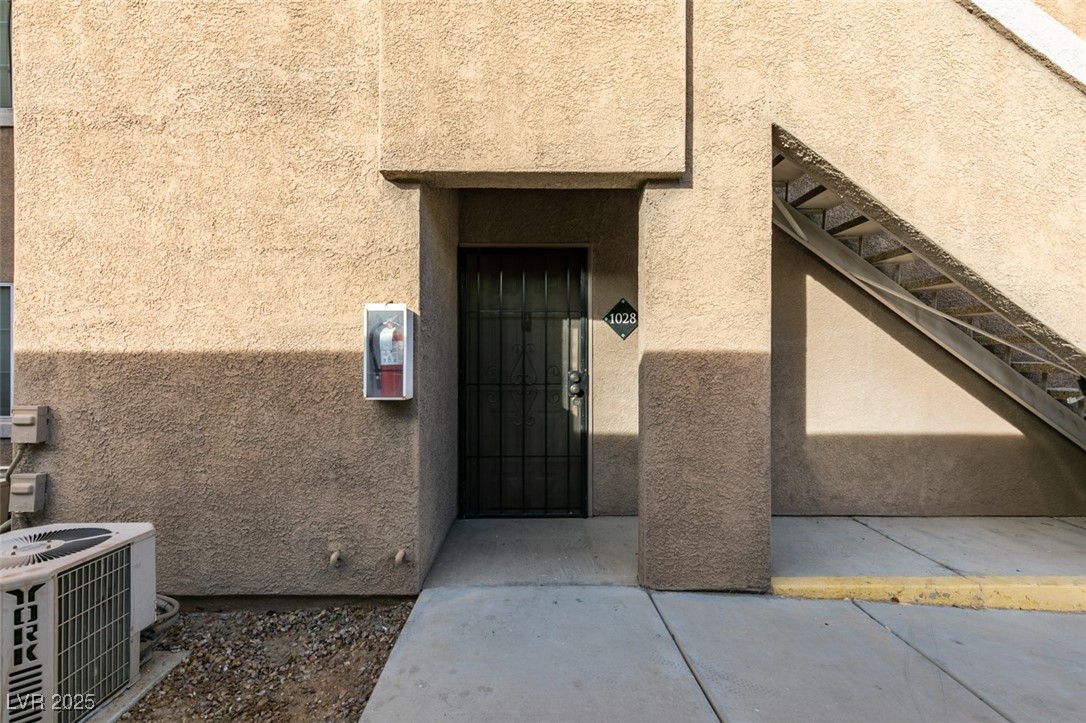 5525 West Flamingo Road, Unit 1028 Las Vegas, NV 89103 - Photo 2 of 42 Doorway to property featuring stucco siding
